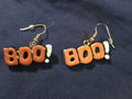 Vintage orange and black "BOO!" dangling earrings