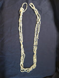 Vintage multi-strand rice pearl necklace featuring blue lapis lazuli accents