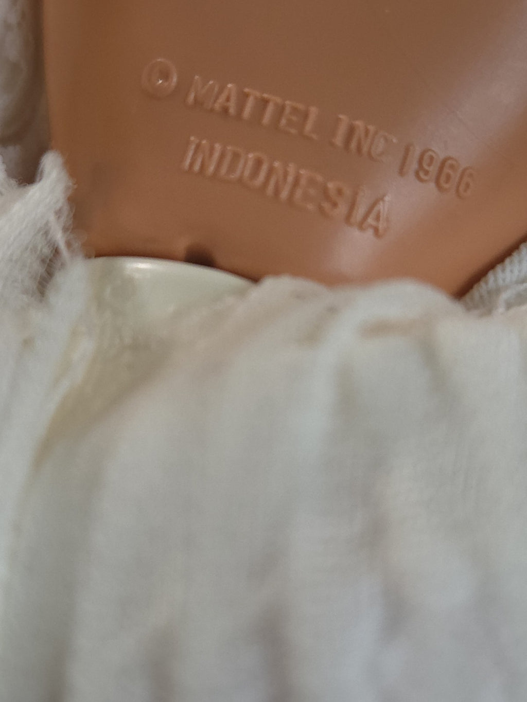 Mattel Barbie doll wearing a white pleated vintage wedding dress