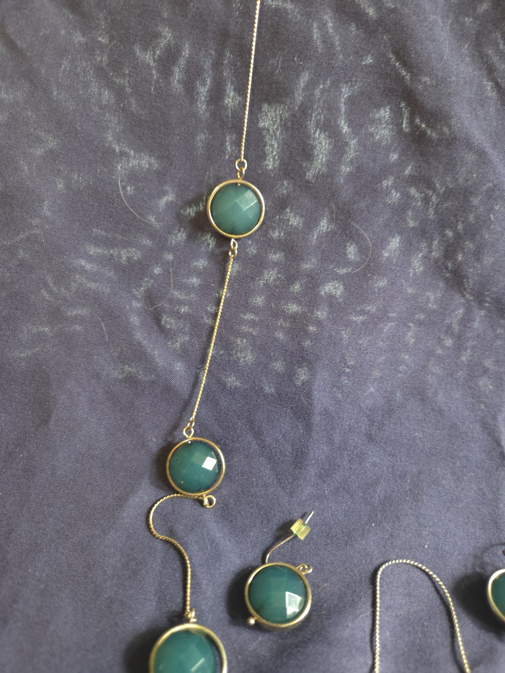 bezel-set green gemstone long chain necklace and earrings featuring faceted...
