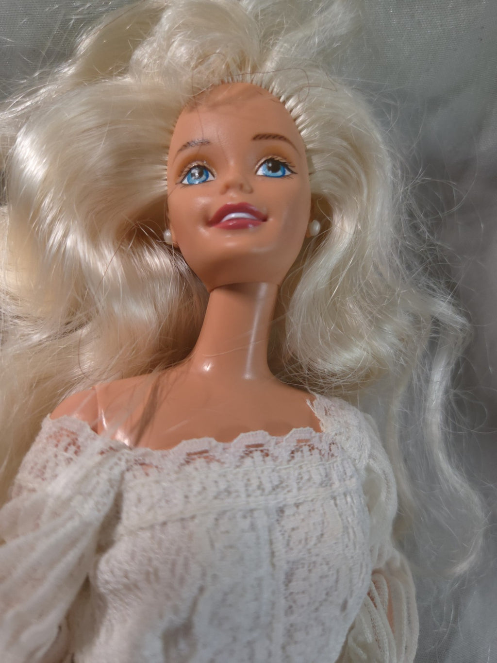 Mattel Barbie doll wearing a white pleated vintage wedding dress