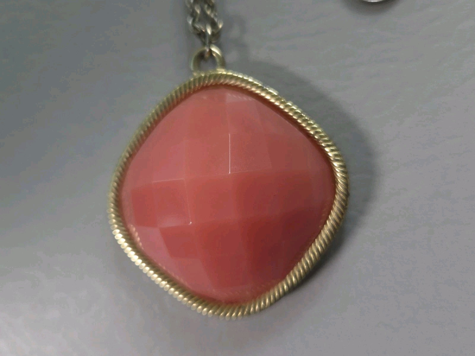 Vintage Estate Jewelry - faceted coral-colored pendant on a goldtone chain