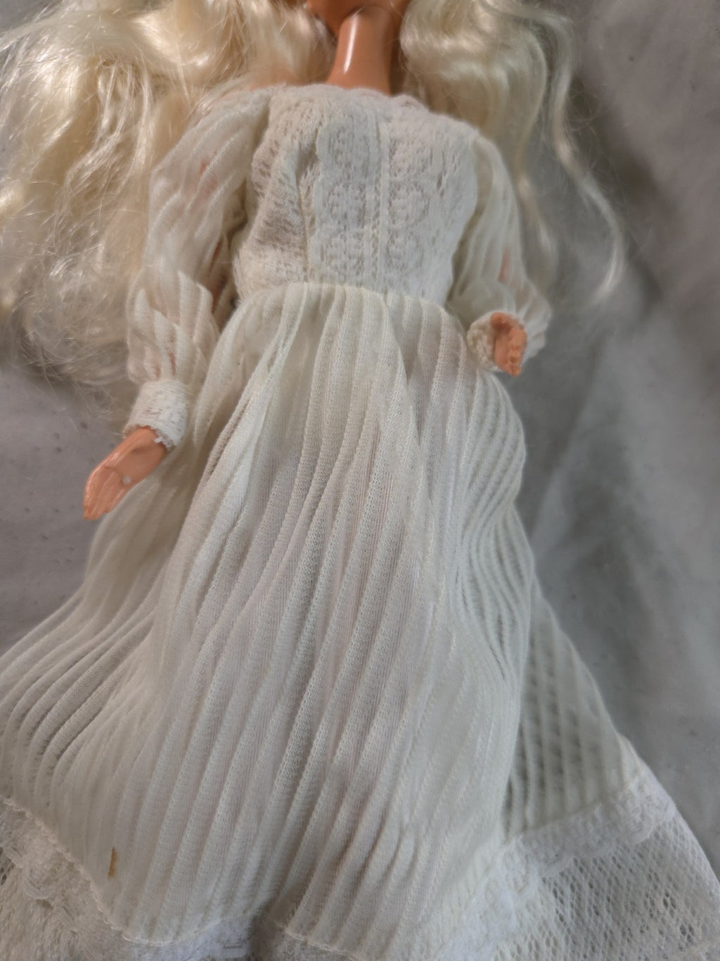 Mattel Barbie doll wearing a white pleated vintage wedding dress