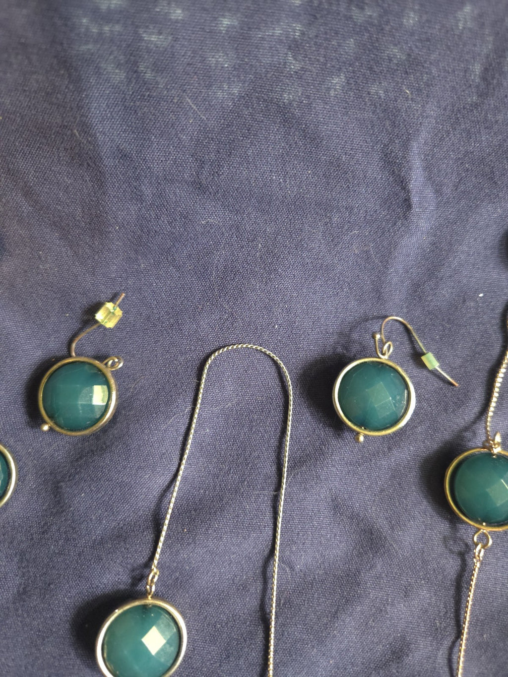 bezel-set green gemstone long chain necklace and earrings featuring faceted...