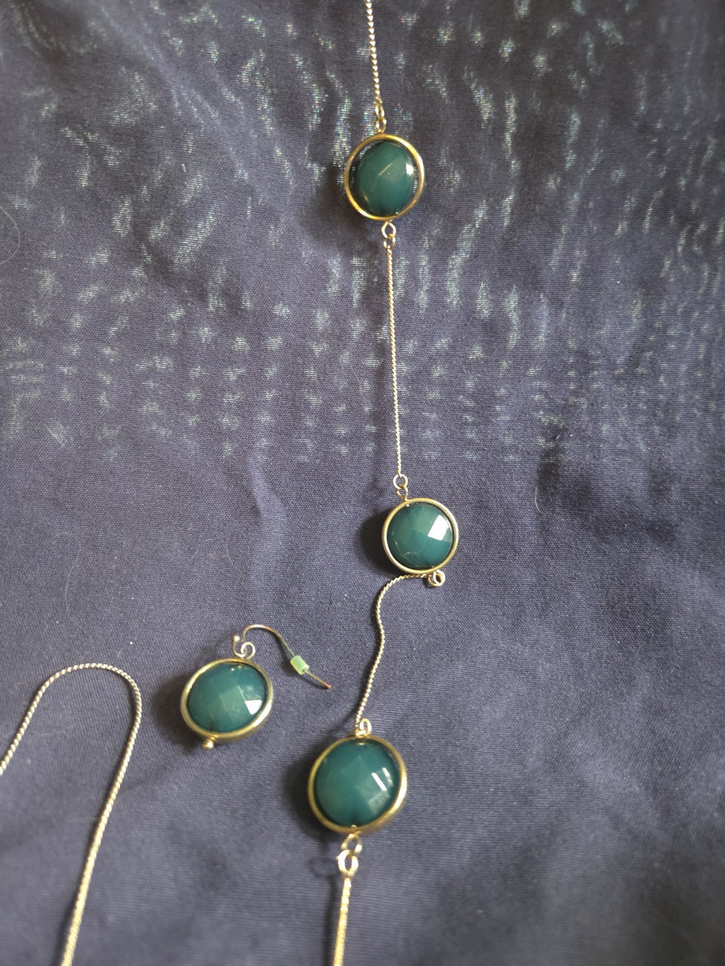bezel-set green gemstone long chain necklace and earrings featuring faceted...
